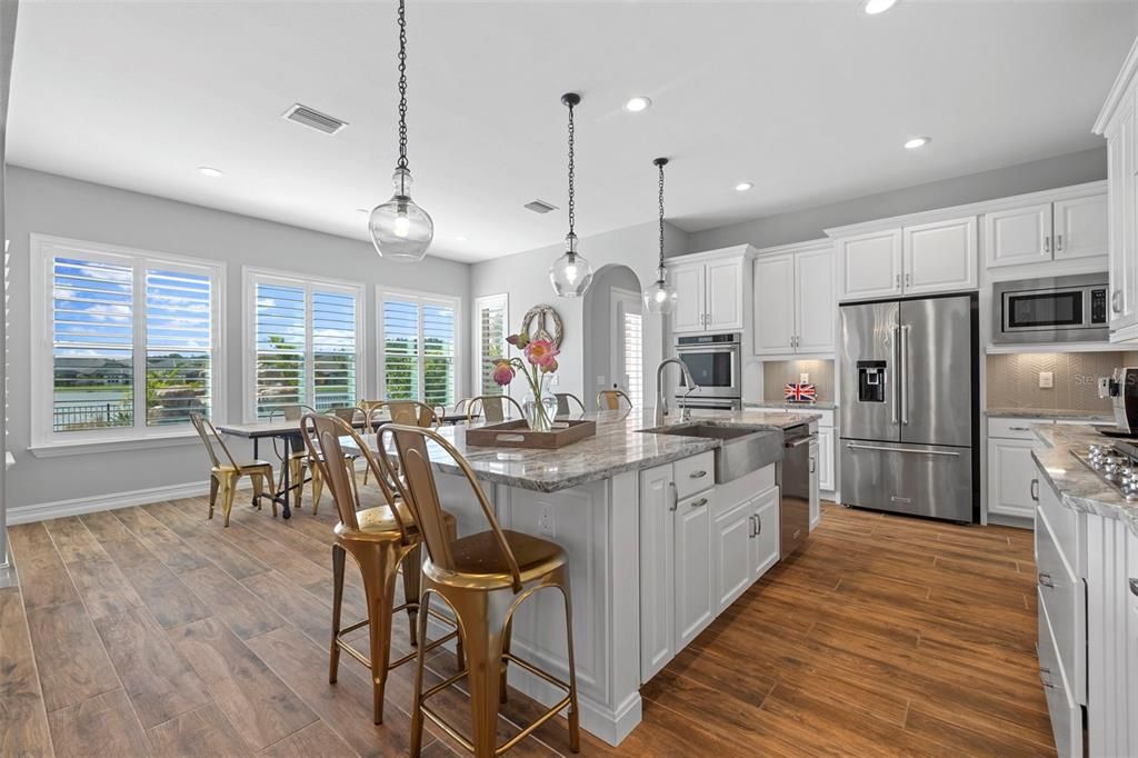 Dining room, Interior, Kitchen, Pendant Lights, Recessed Lighting, Stainless Steel Appliances, Wood Texture Flooring