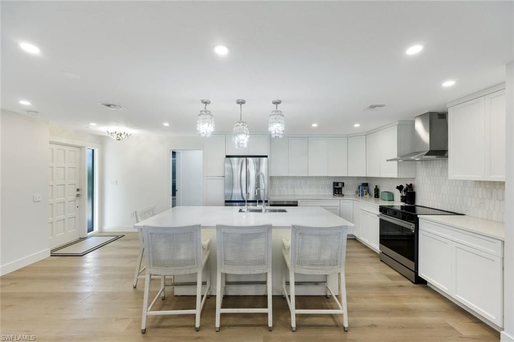 Chandelier, Interior, Kitchen, Pendant Lights, Recessed Lighting, Stainless Steel Appliances, Wood Texture Flooring