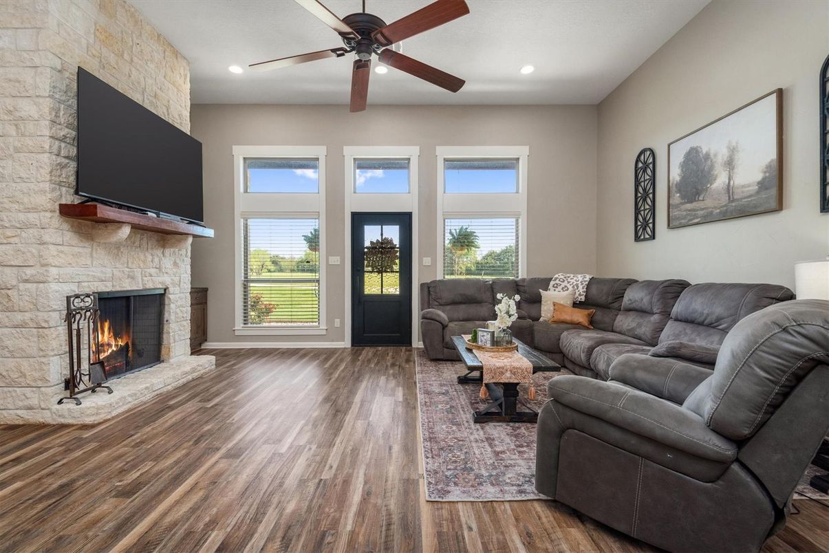 Fireplace, Interior, Living room, Recessed Lighting, Stone Walls, Wood Texture Flooring