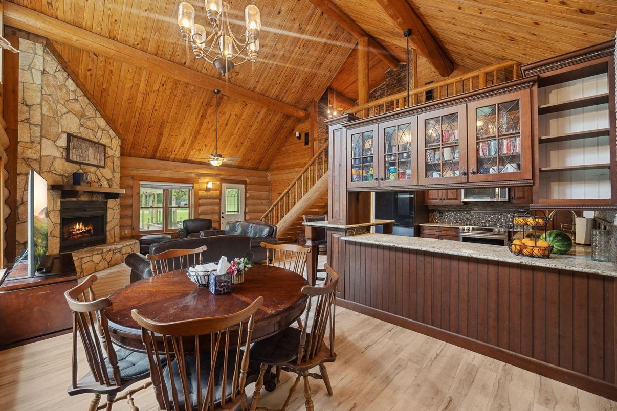 Chandelier, Dining room, Fireplace, Interior, Stone Walls, Wooden Beams, Wooden Ceilings, Wood Texture Flooring