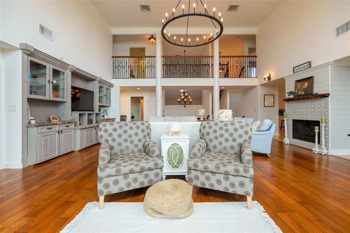 Chandelier, Fireplace, Interior, Living room, Pendant Lights, Recessed Lighting, Wood Texture Flooring