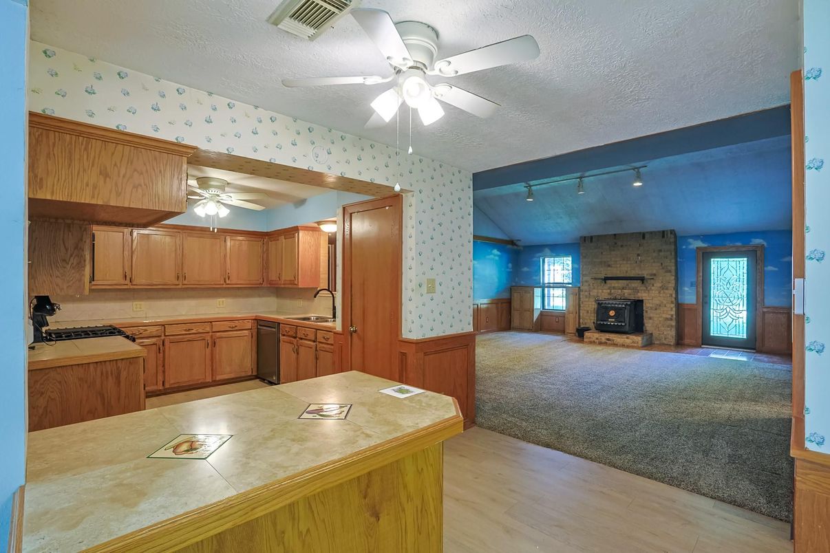 Empty room, Fireplace, Interior, Kitchen, Stone Walls, Wood Texture Flooring