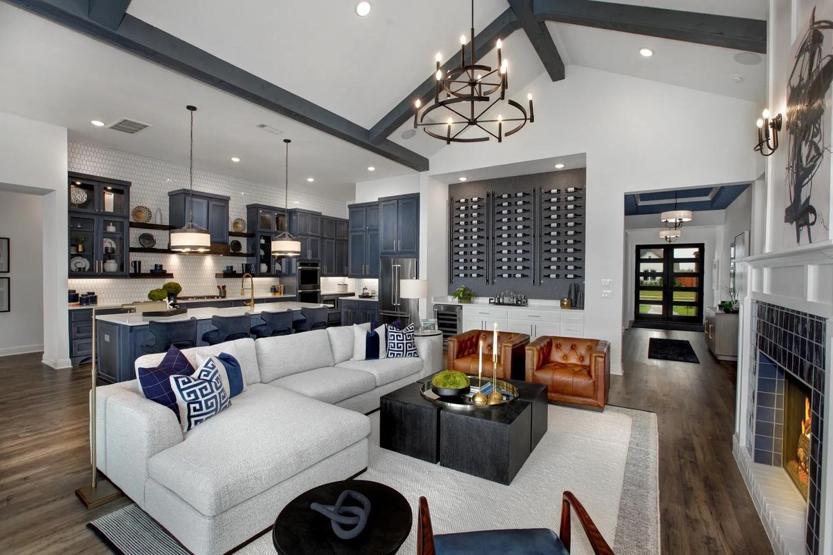 Chandelier, Fireplace, Interior, Kitchen, Living room, Pendant Lights, Recessed Lighting, Stainless Steel Appliances, Wood Texture Flooring