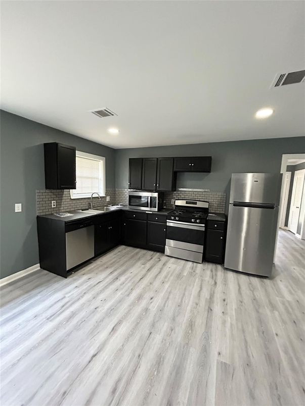 Interior, Kitchen, Recessed Lighting, Stainless Steel Appliances, Wood Texture Flooring