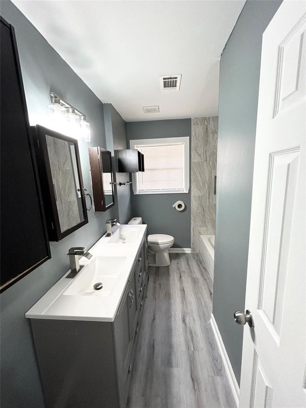 Bathroom, Dual Sink Vanities, Interior, Marble Walls, Wood Texture Flooring