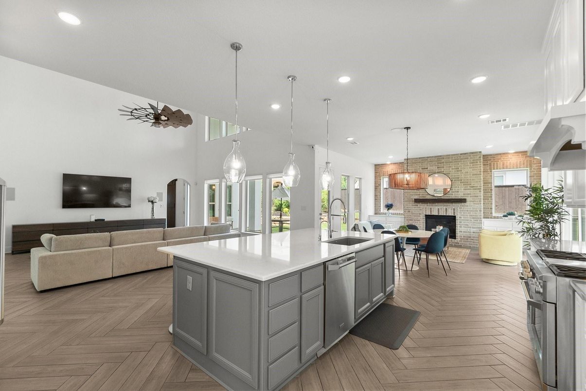 Dining room, Fireplace, Interior, Kitchen, Pendant Lights, Recessed Lighting, Stainless Steel Appliances, Stone Walls, Wood Texture Flooring