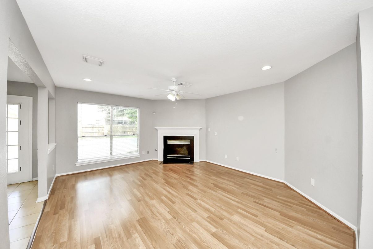 Empty room, Fireplace, Interior, Recessed Lighting, Wood Texture Flooring