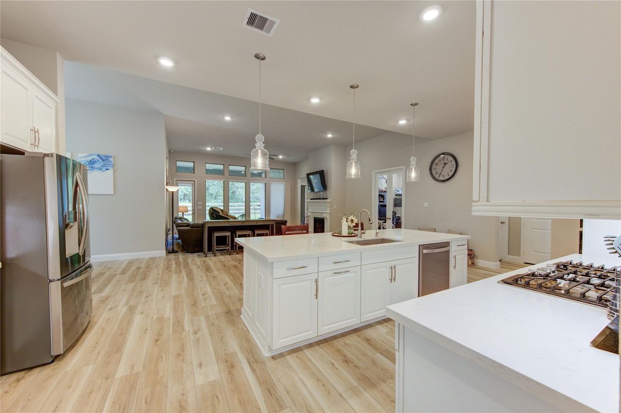 Dining room, Fireplace, Interior, Kitchen, Pendant Lights, Recessed Lighting, Wood Texture Flooring