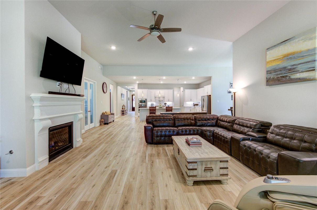 Fireplace, Interior, Kitchen, Living room, Recessed Lighting, Wood Texture Flooring