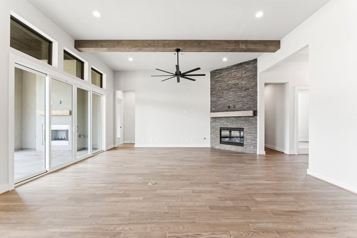 Empty room, Fireplace, Interior, Recessed Lighting, Stone Walls, Wooden Beams, Wood Texture Flooring