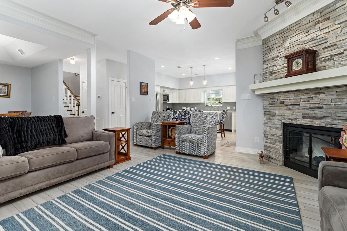 Fireplace, Interior, Kitchen, Living room, Pendant Lights, Recessed Lighting, Stainless Steel Appliances, Stone Walls