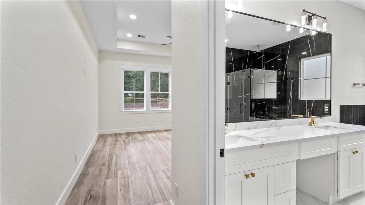Bathroom, Dual Sink Vanities, Interior, Recessed Lighting, Wood Texture Flooring