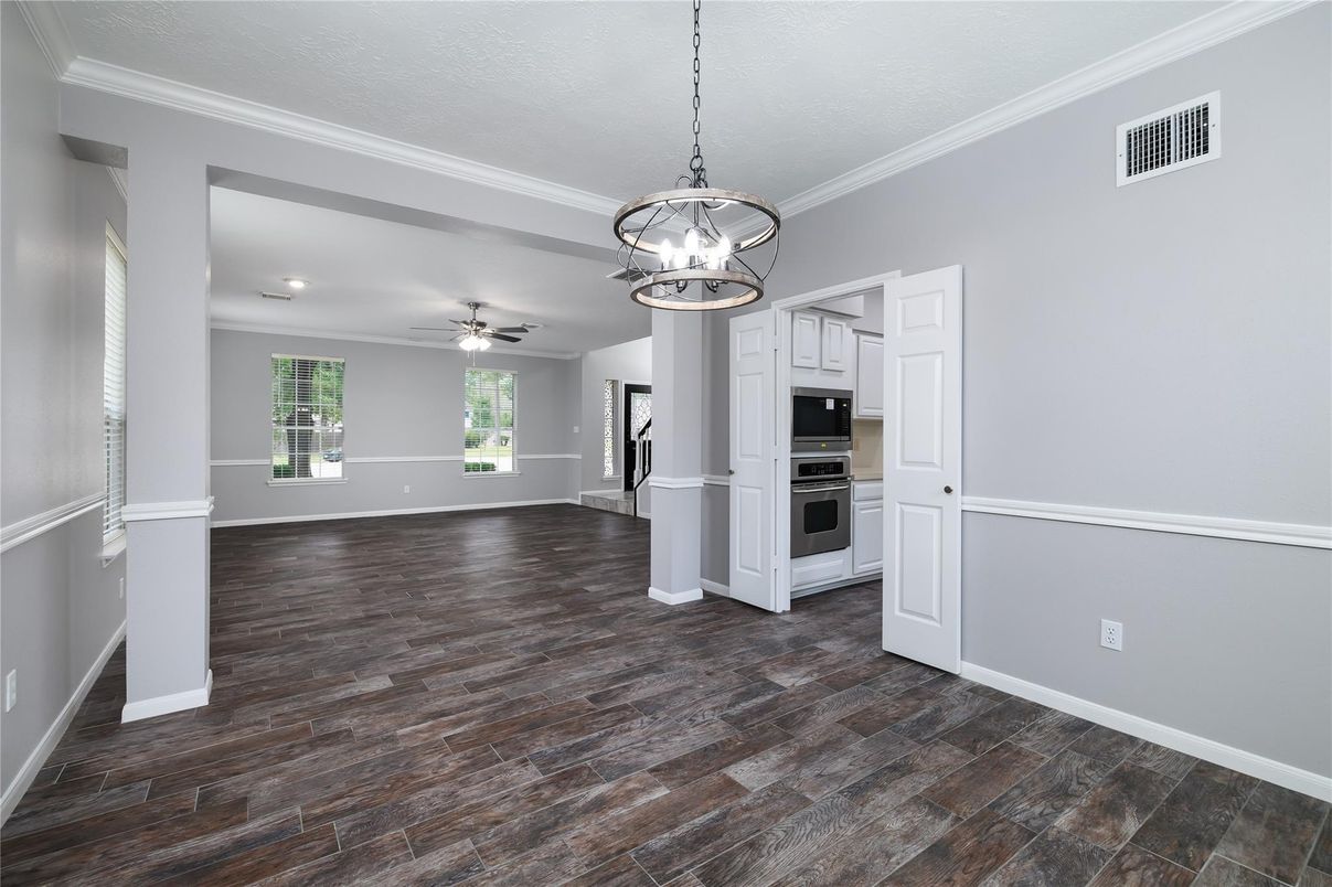 Empty room, Interior, Kitchen, Pendant Lights, Stainless Steel Appliances, Wood Texture Flooring