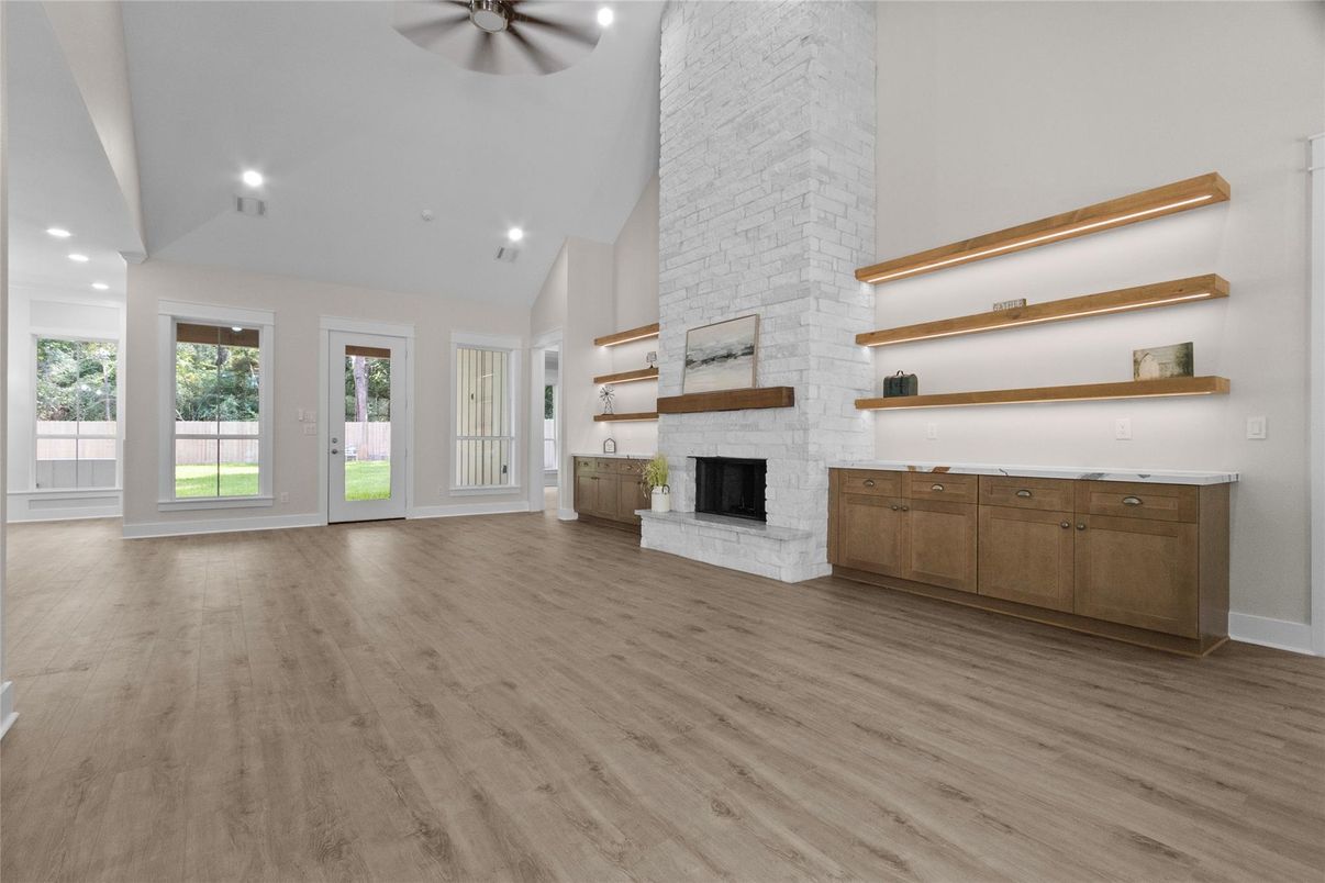 Empty room, Fireplace, Interior, Recessed Lighting, Stone Walls, Wood Texture Flooring
