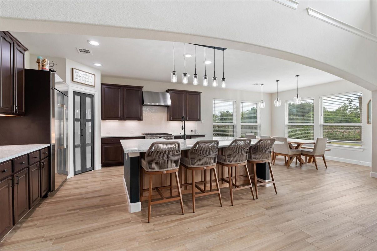 Dining room, Interior, Kitchen, Pendant Lights, Recessed Lighting, Stainless Steel Appliances, Wood Texture Flooring