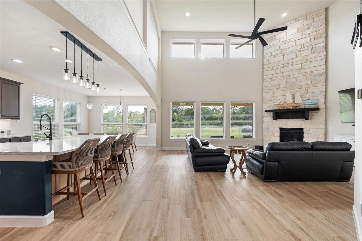Fireplace, Interior, Living room, Pendant Lights, Recessed Lighting, Stone Walls, Wood Texture Flooring
