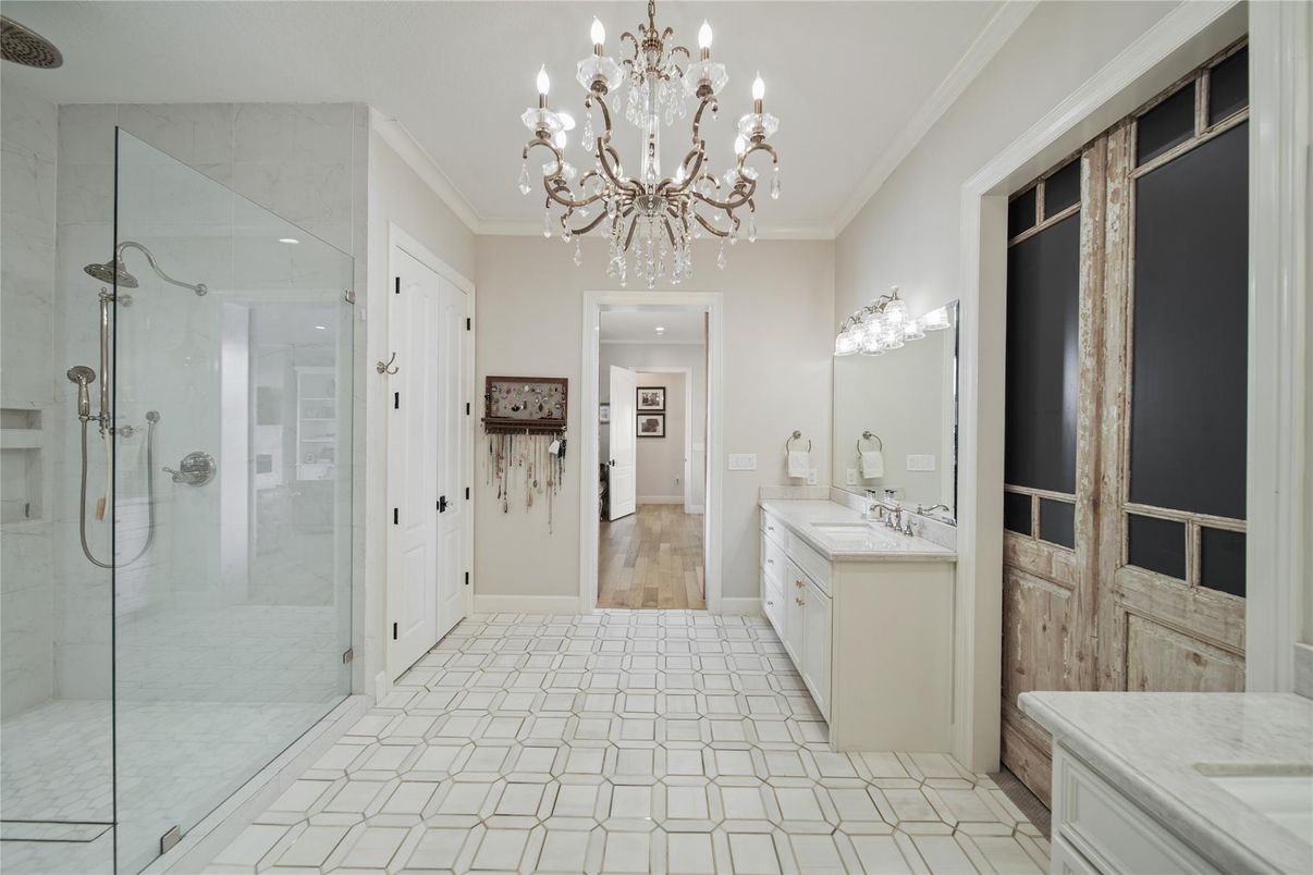 Bathroom, Chandelier, Dual Sink Vanities, Glass Shower, Interior, Wood Texture Flooring