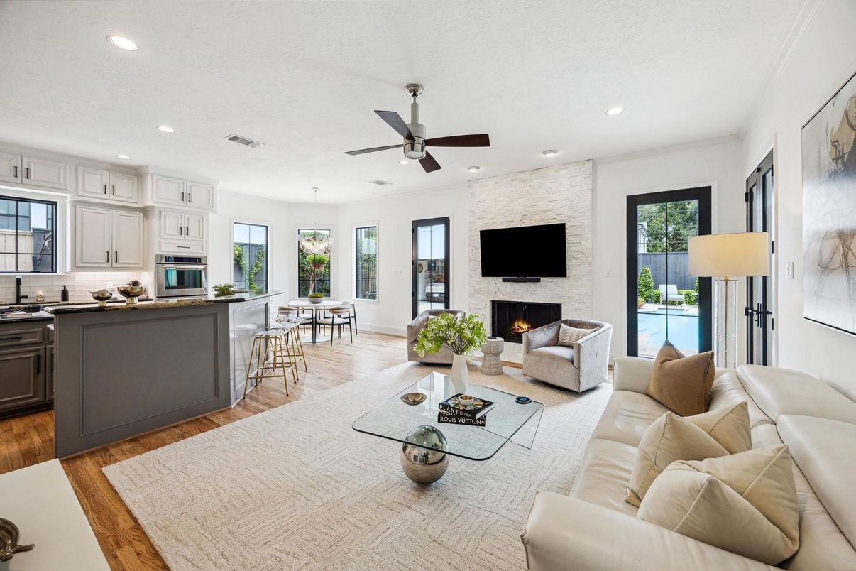 Dining room, Fireplace, Interior, Kitchen, Living room, Recessed Lighting, Stone Walls, Wood Texture Flooring