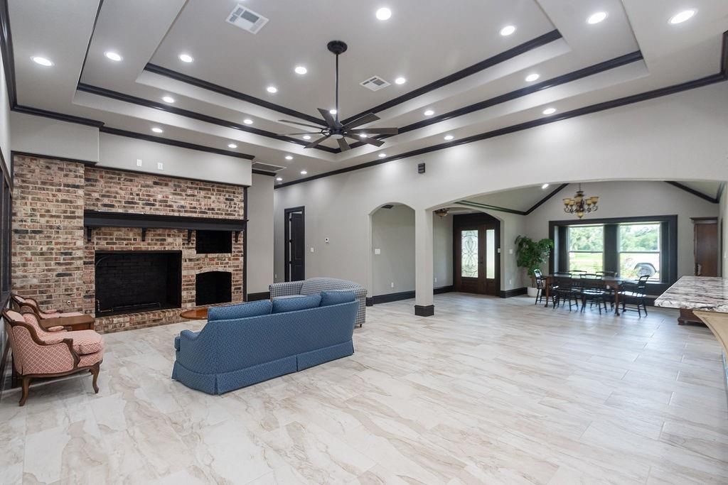 Dining room, Fireplace, Interior, Living room, Marble, Pendant Lights, Recessed Lighting, Stone Walls