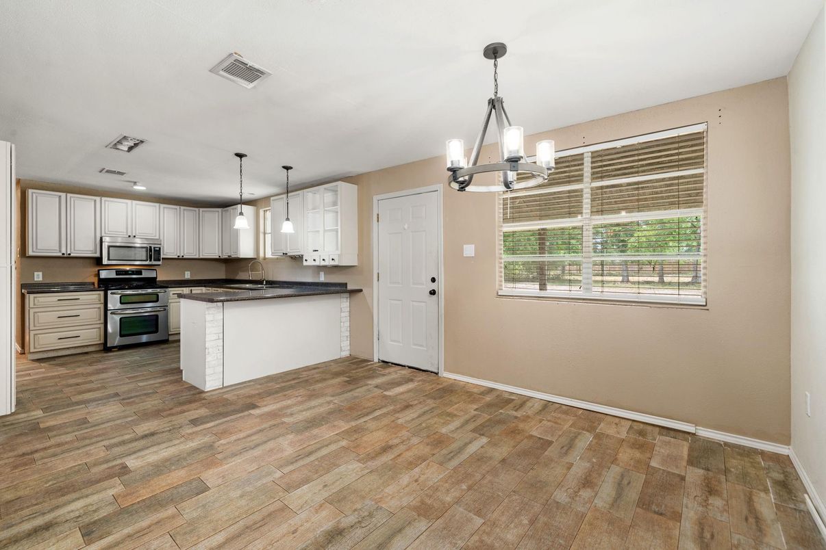 Chandelier, Interior, Kitchen, Pendant Lights, Recessed Lighting, Stainless Steel Appliances, Wood Texture Flooring