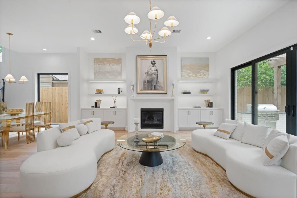 Chandelier, Dining room, Fireplace, Interior, Living room, Pendant Lights, Recessed Lighting, Wood Texture Flooring