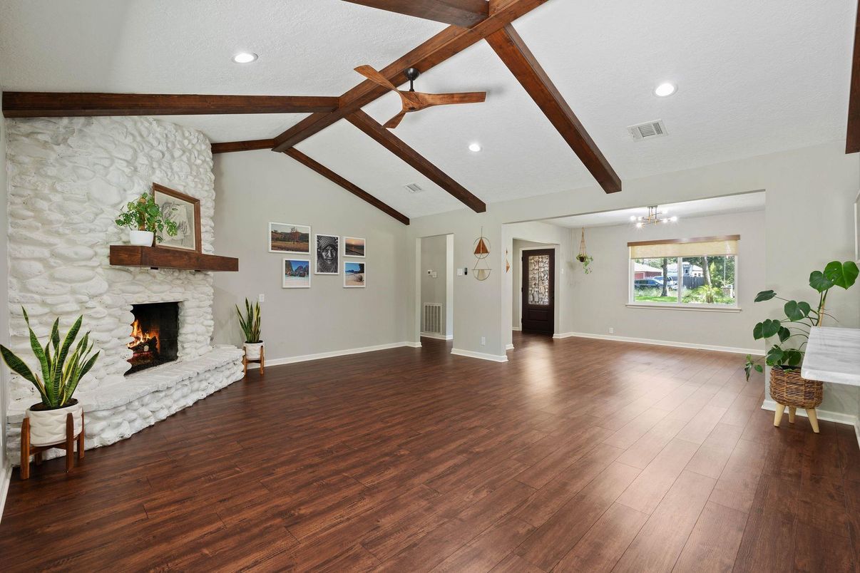 Empty room, Fireplace, Interior, Recessed Lighting, Stone Walls, Wooden Beams, Wood Texture Flooring