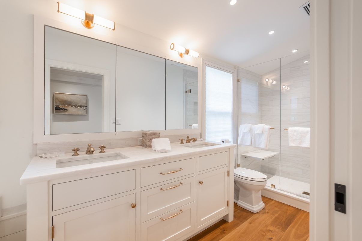 Bathroom, Dual Sink Vanities, Glass Shower, Interior, Recessed Lighting, Wood Texture Flooring