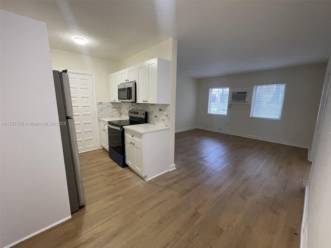 Empty room, Interior, Kitchen, Stainless Steel Appliances, Wood Texture Flooring