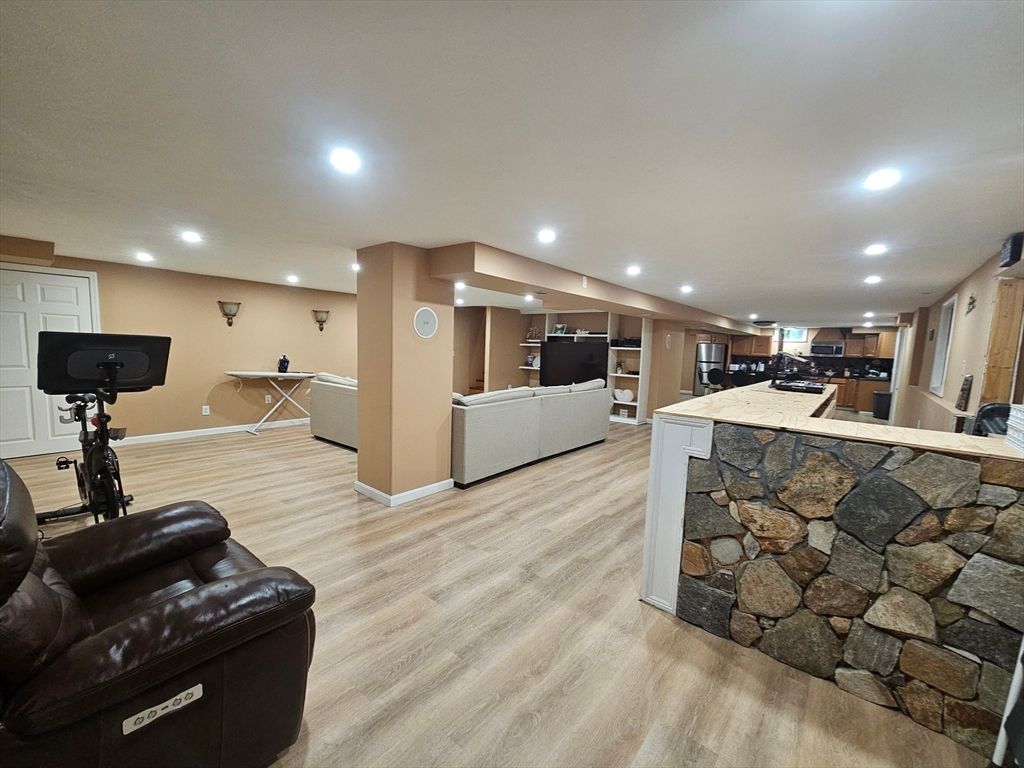 Fitness Equipment, Interior, Kitchen, Living room, Recessed Lighting, Stone Walls, Wood Texture Flooring