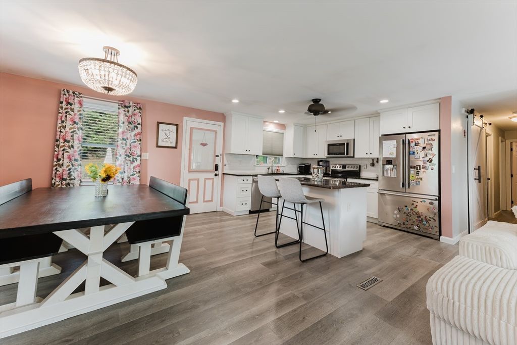 Chandelier, Dining room, Interior, Kitchen, Recessed Lighting, Stainless Steel Appliances, Wood Texture Flooring