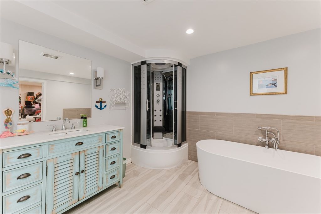 Bathroom, Free Standing Baths, Glass Shower, Interior, Recessed Lighting, Wood Texture Flooring