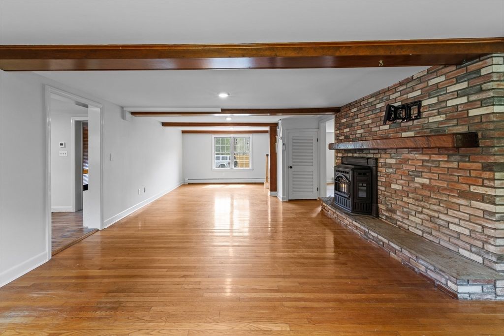 Empty room, Fireplace, Interior, Recessed Lighting, Stone Walls, Wooden Beams, Wood Texture Flooring