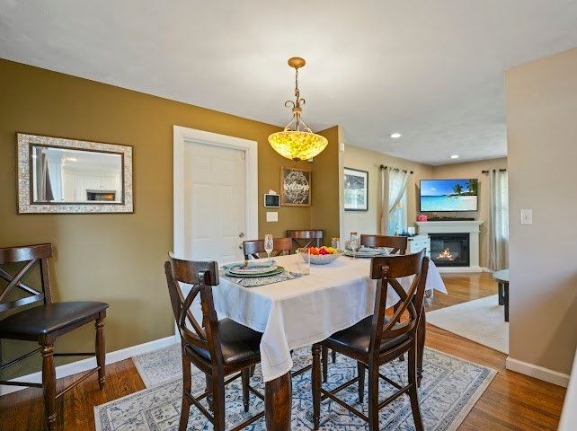 Dining room, Fireplace, Interior, Pendant Lights, Recessed Lighting, Wood Texture Flooring