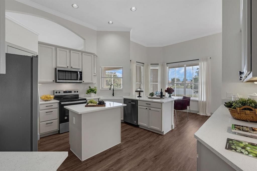 Dining room, Interior, Kitchen, Recessed Lighting, Stainless Steel Appliances, Wood Texture Flooring