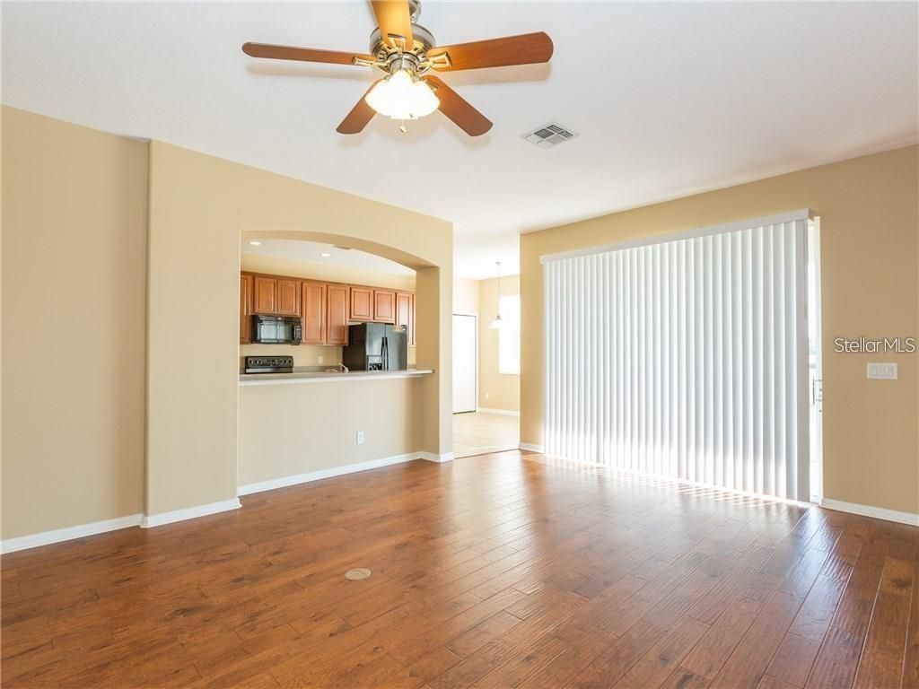 Empty room, Interior, Kitchen, Recessed Lighting, Stainless Steel Appliances, Wood Texture Flooring