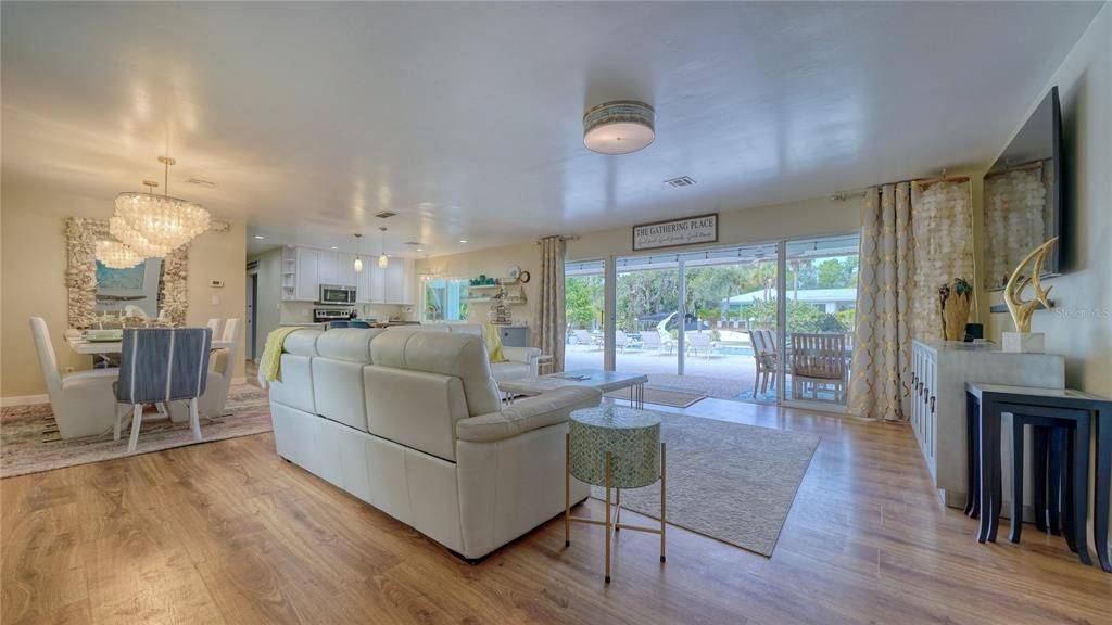 Chandelier, Dining room, Fireplace, Interior, Kitchen, Living room, Pendant Lights, Wood Texture Flooring