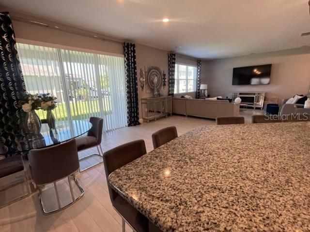 Dining room, Fireplace, Interior, Living room, Recessed Lighting, Wood Texture Flooring