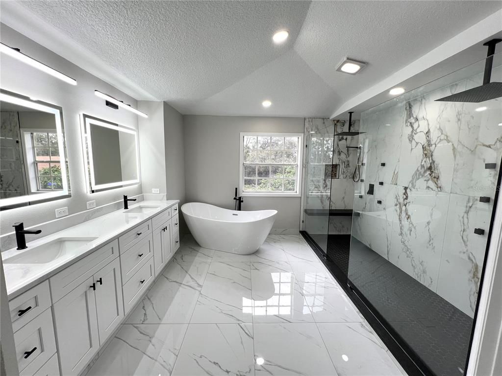Bathroom, Dual Sink Vanities, Free Standing Baths, Glass Shower, Interior, Marble, Marble Walls, Recessed Lighting