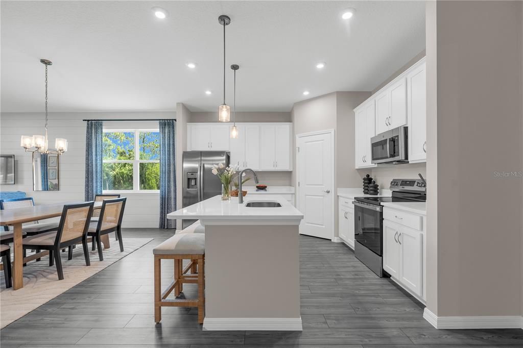 Chandelier, Dining room, Interior, Kitchen, Pendant Lights, Recessed Lighting, Stainless Steel Appliances, Wood Texture Flooring