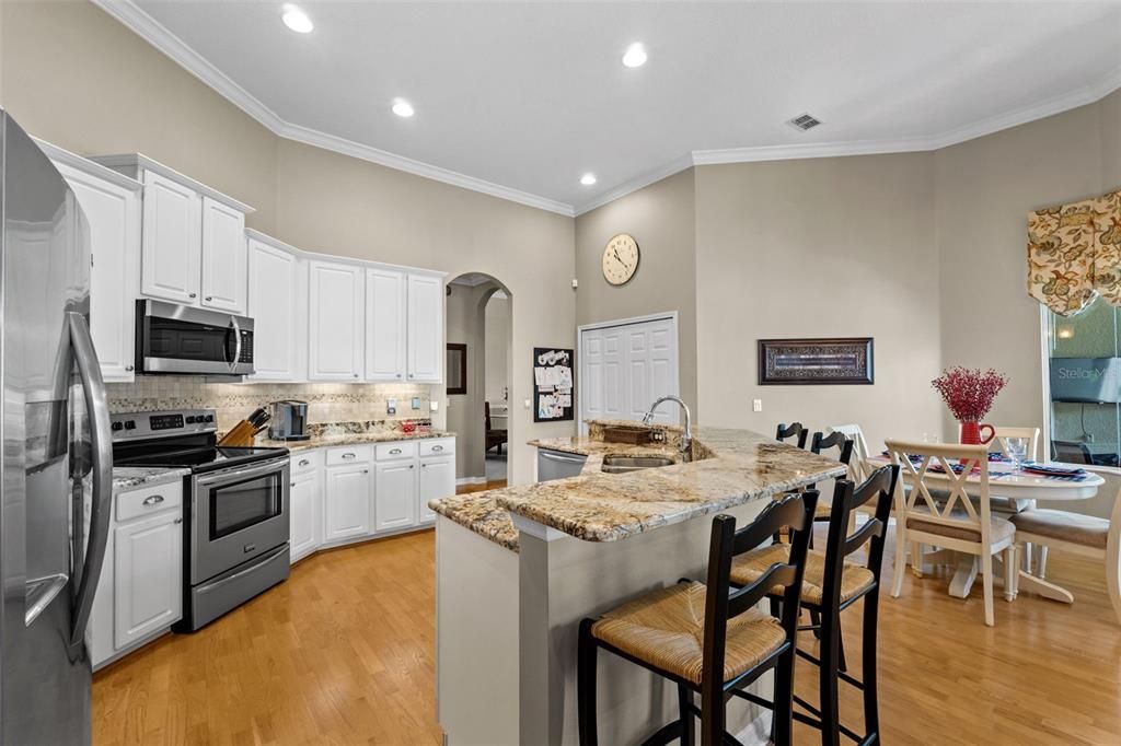 Dining room, Interior, Kitchen, Recessed Lighting, Stainless Steel Appliances, Wood Texture Flooring