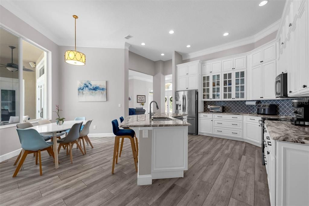 Dining room, Interior, Kitchen, Pendant Lights, Recessed Lighting, Stainless Steel Appliances, Wood Texture Flooring