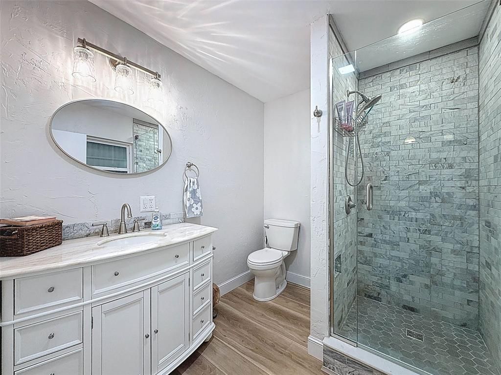 Bathroom, Glass Shower, Interior, Recessed Lighting, Wood Texture Flooring