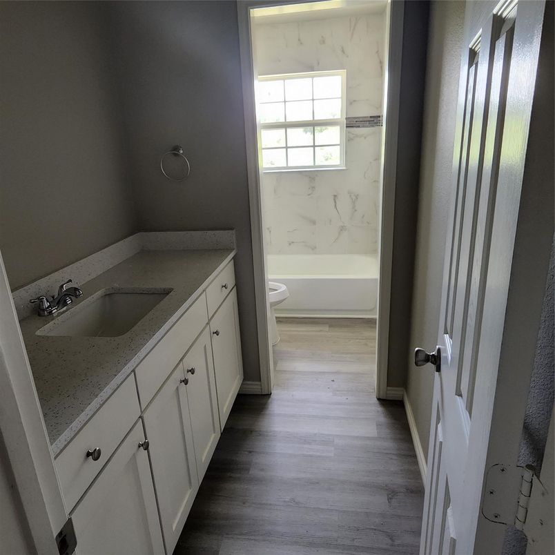 Bathroom, Dual Sink Vanities, Interior, Marble Walls, Wood Texture Flooring