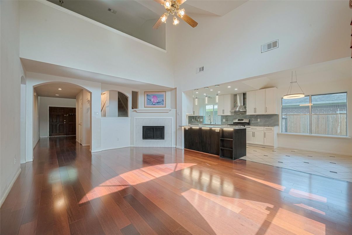 Fireplace, Interior, Kitchen, Recessed Lighting, Stainless Steel Appliances, Wood Texture Flooring