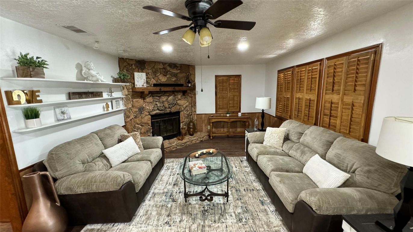 Fireplace, Interior, Living room, Recessed Lighting, Stone Walls, Wood Texture Flooring