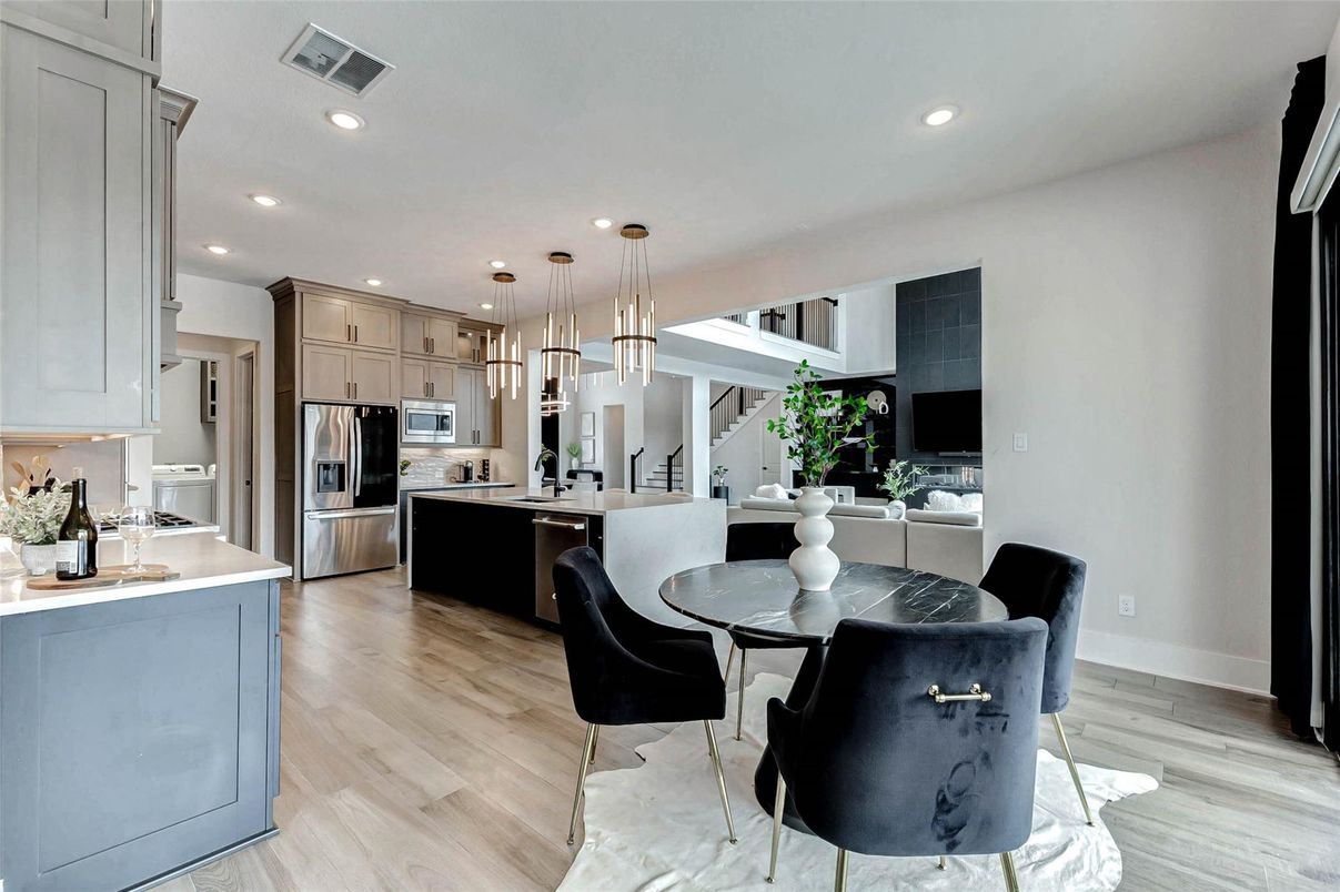 Dining room, Interior, Kitchen, Pendant Lights, Recessed Lighting, Stainless Steel Appliances, Wood Texture Flooring