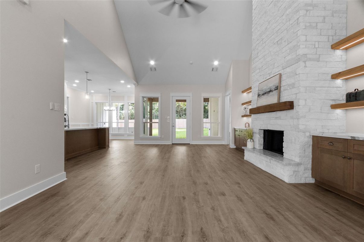 Empty room, Fireplace, Interior, Pendant Lights, Recessed Lighting, Stone Walls, Wood Texture Flooring