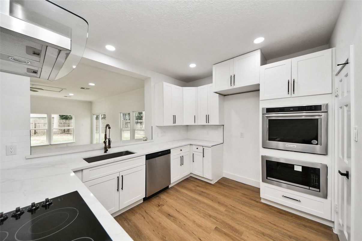 Interior, Kitchen, Recessed Lighting, Stainless Steel Appliances, Wood Texture Flooring