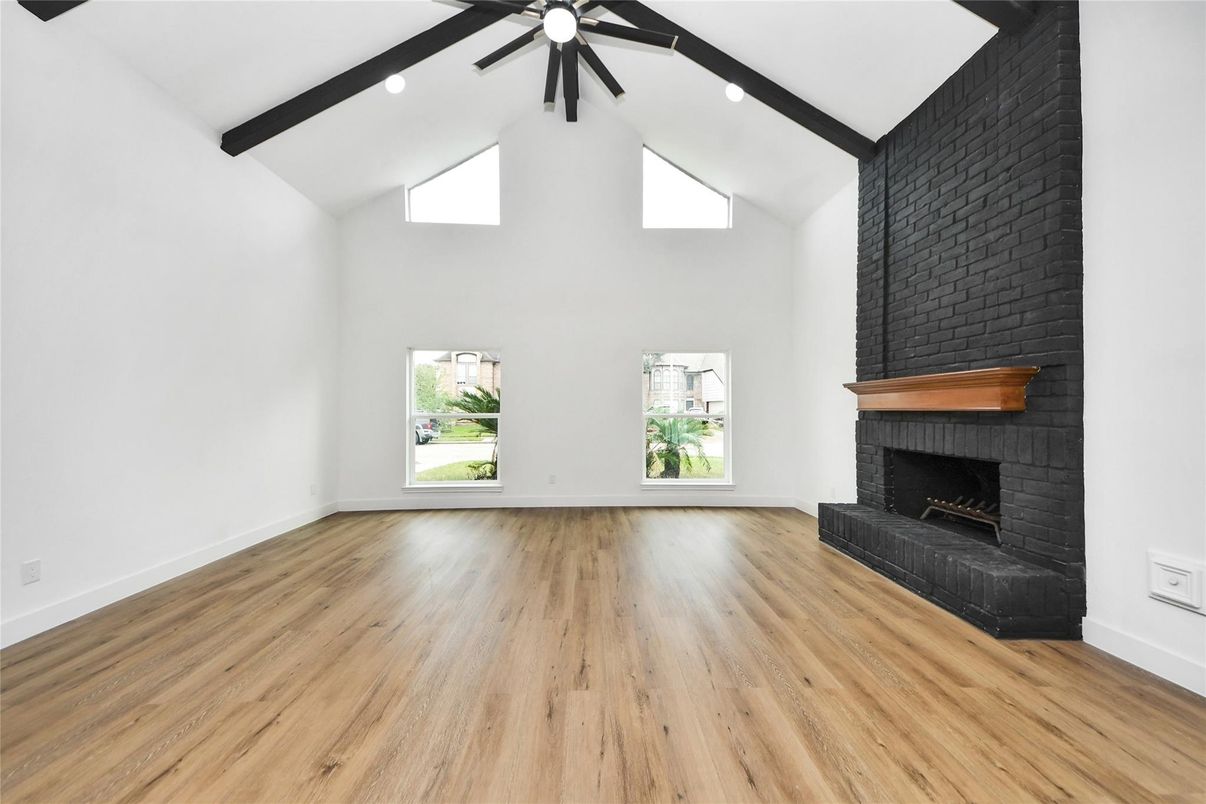 Empty room, Fireplace, Interior, Recessed Lighting, Wooden Beams, Wood Texture Flooring