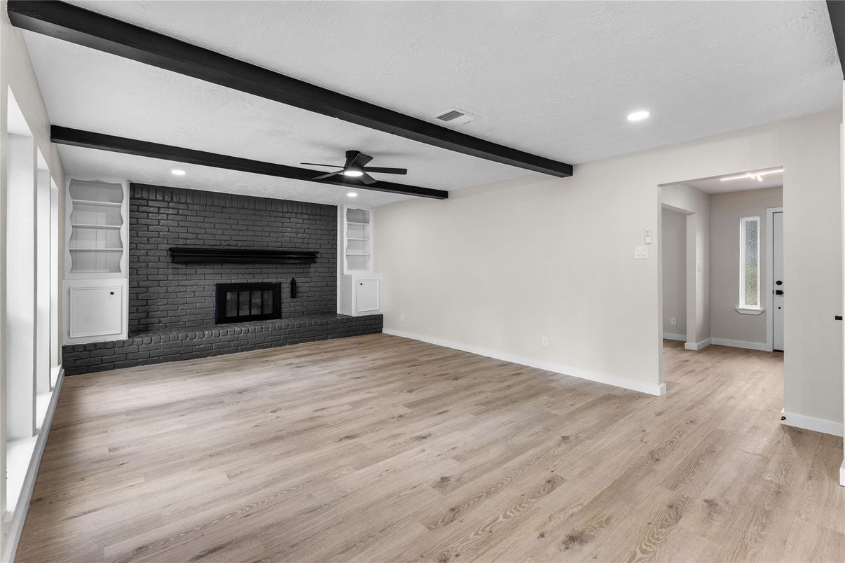 Empty room, Fireplace, Interior, Recessed Lighting, Stone Walls, Wooden Beams, Wood Texture Flooring